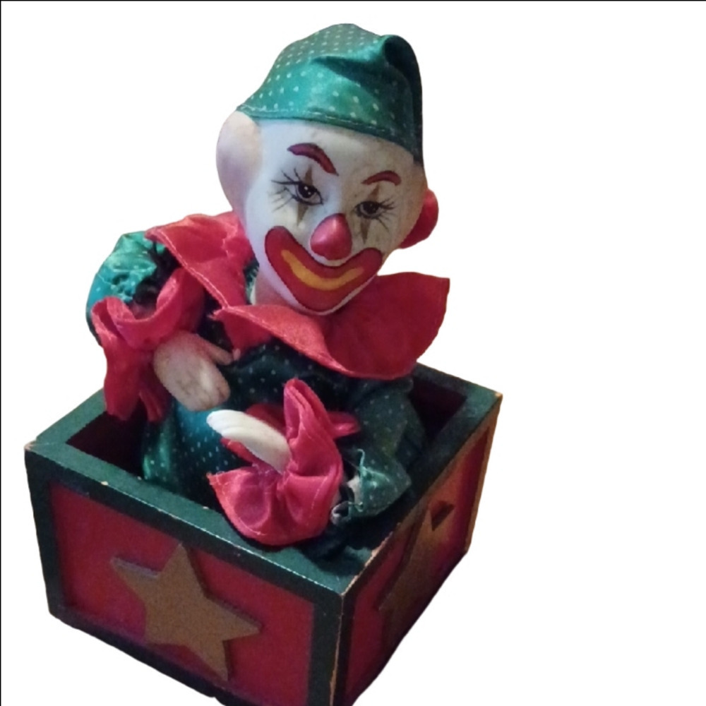 - Vintage Colorful Clown Jack-in-the-Box Toy